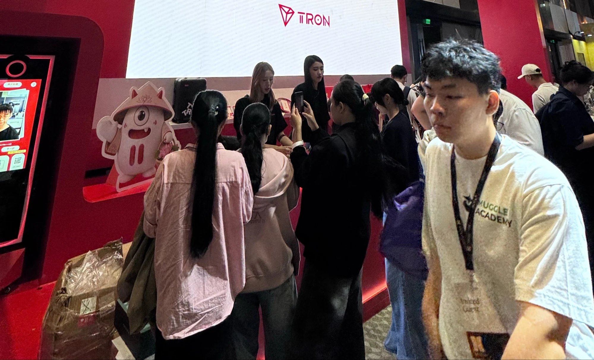 Crowd at the TRON booth at Conviction 2026